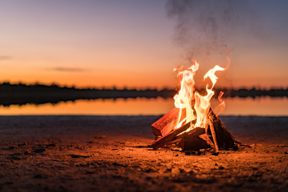 campfire near lake 